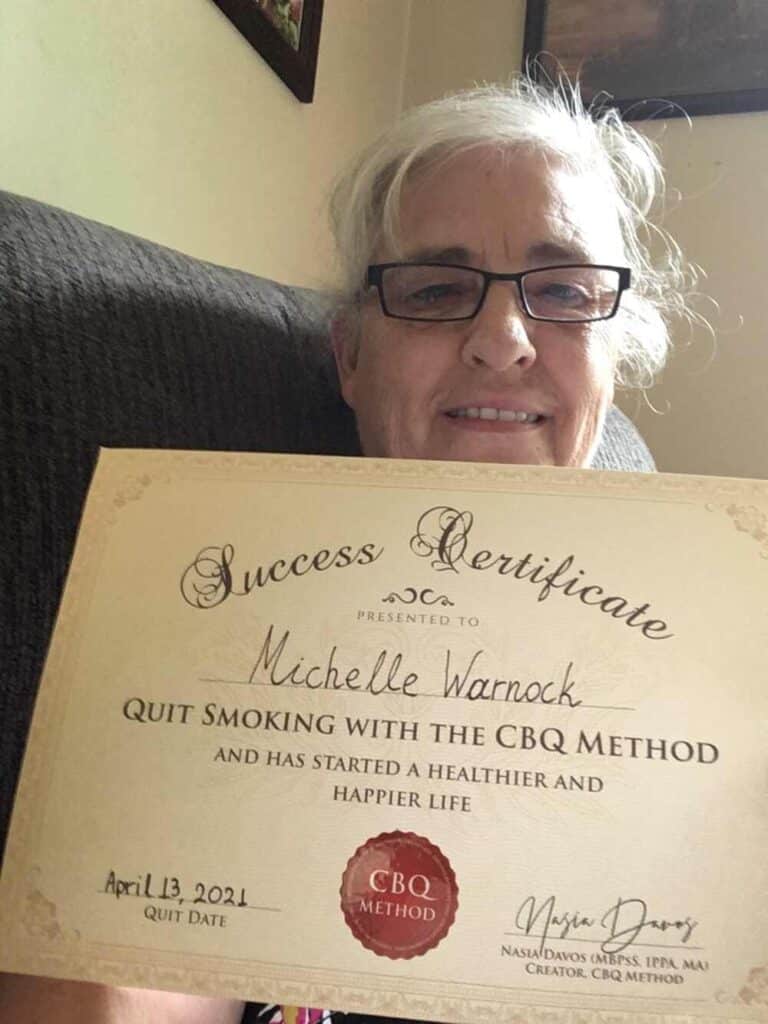 Michelle Warnock holding her CBQ Success Certificate