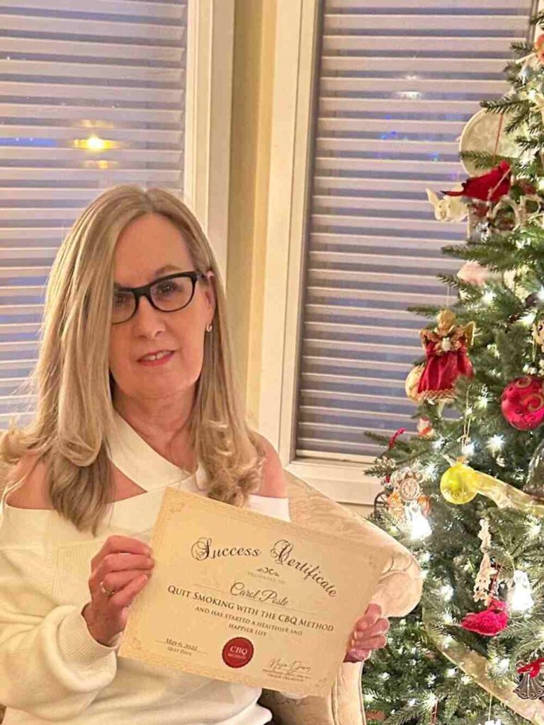 Carol Poste holding her CBQ Success Certificate