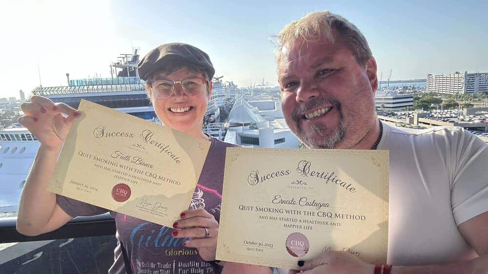 Ernesto Castagna and Faith Bianco holding their CBQ Success Certificates