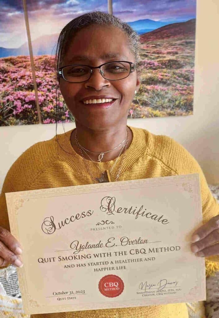 Yolande Overton holding her CBQ Success Certificate