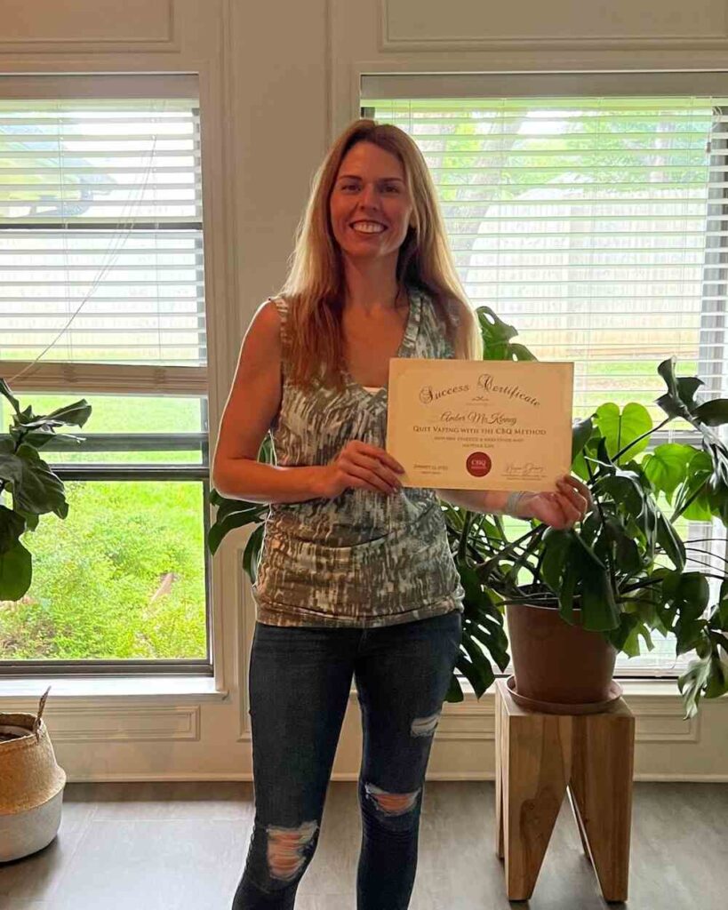 Amber McKinney holding her CBQ Success Certificate