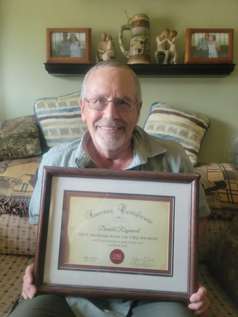 Don Raymond holding his CBQ Success Certificate
