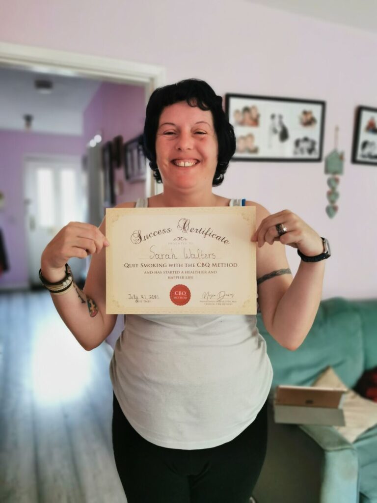 Sarah Walters holding her CBQ Success Certificate