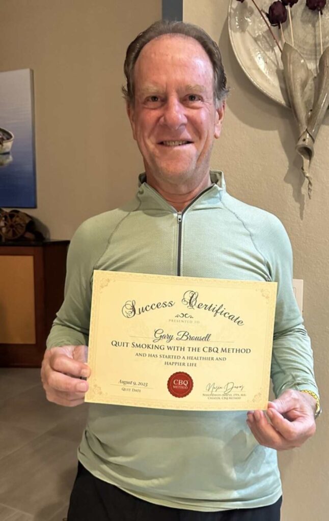 Gary Brousell holding his CBQ Success Certificate