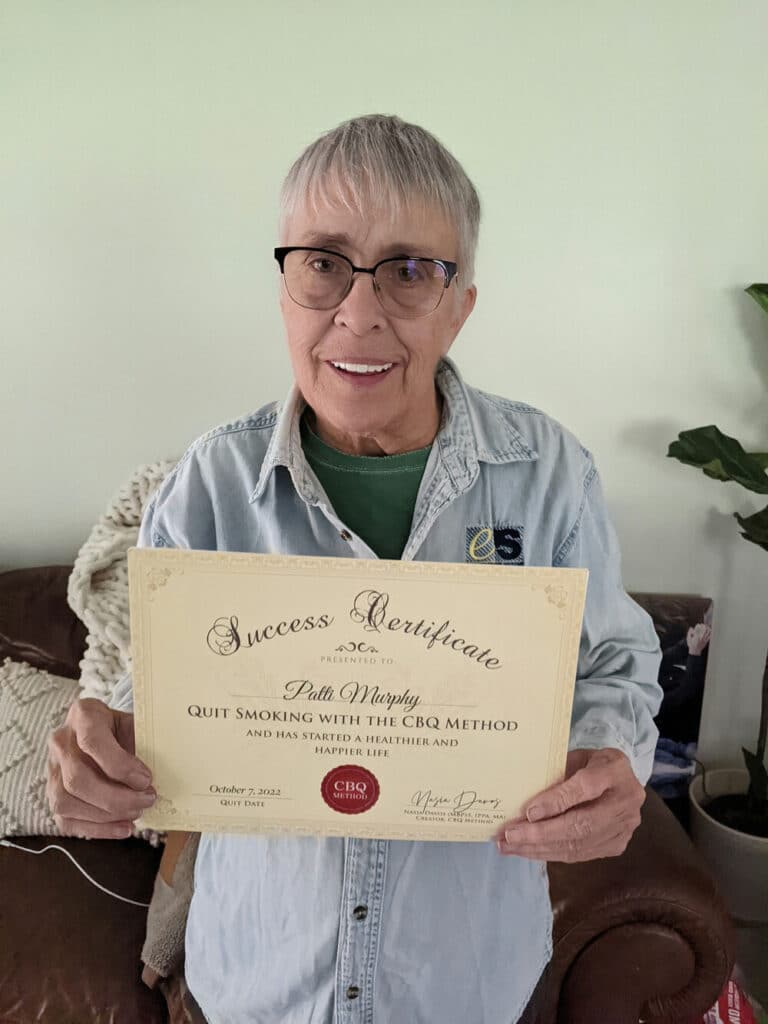 Patti Murphy holding her CBQ Success Certificate