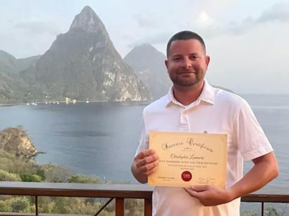 Chris Lammers holding his CBQ Success Certificate