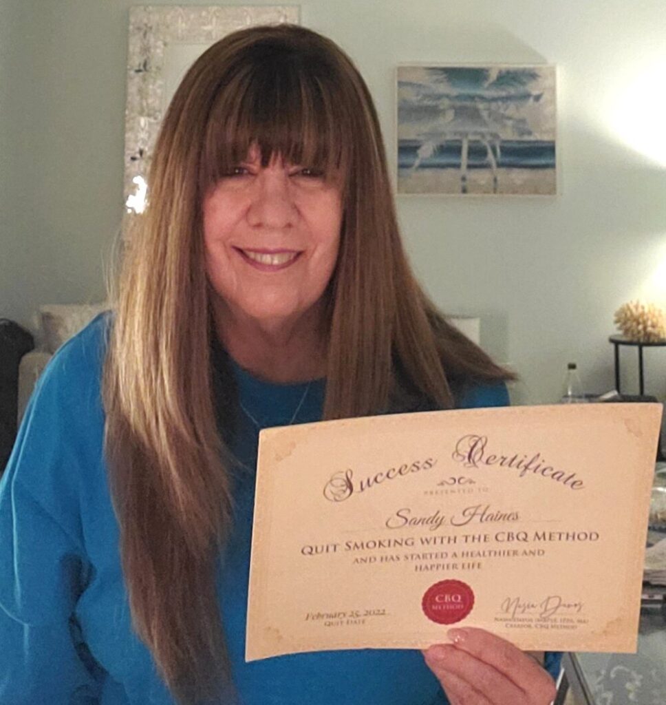 Sandy Haines holding her CBQ Success Certificate