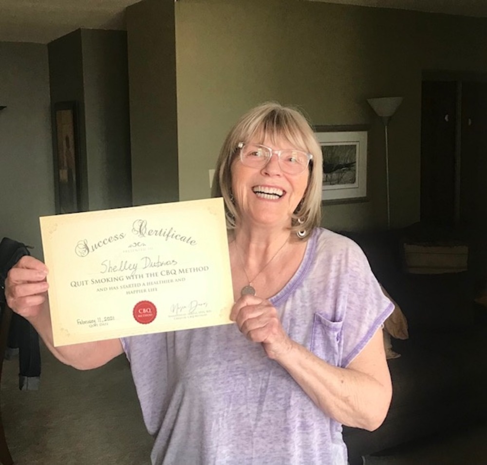 Shelley Dubros holding her CBQ Success Certificate