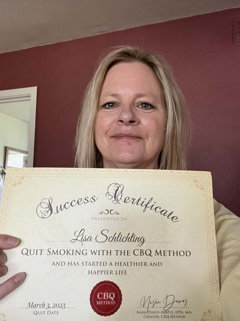 Lisa Schlichting holding her CBQ Success Certificate