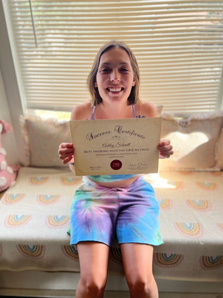 Ashley Schmitt holding her CBQ Success Certificate