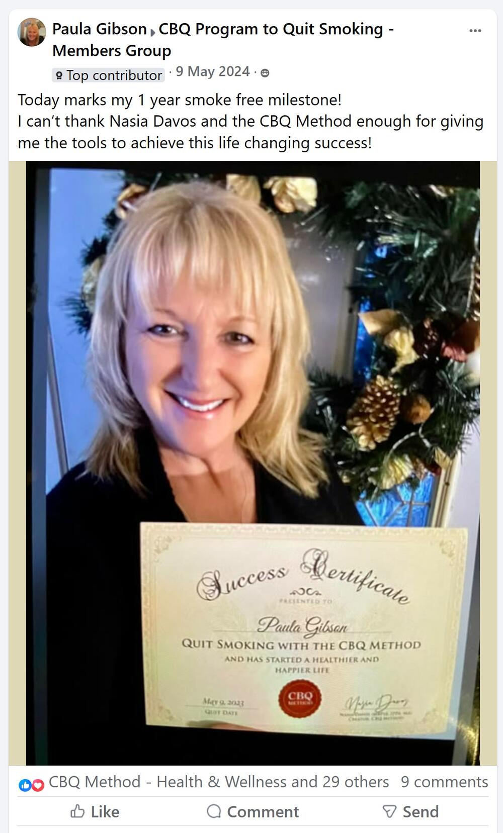 Paula Gibson holding her CBQ Success Certificate
