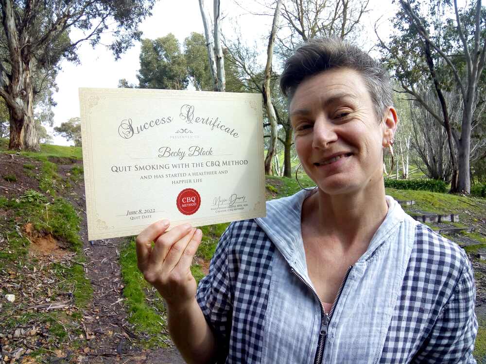 Becky Block holding her CBQ Success Certificate