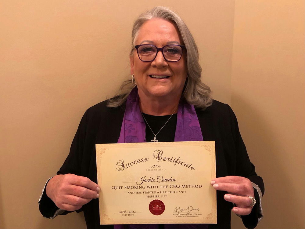 Jackie Cowden holding her CBQ Success Certificate