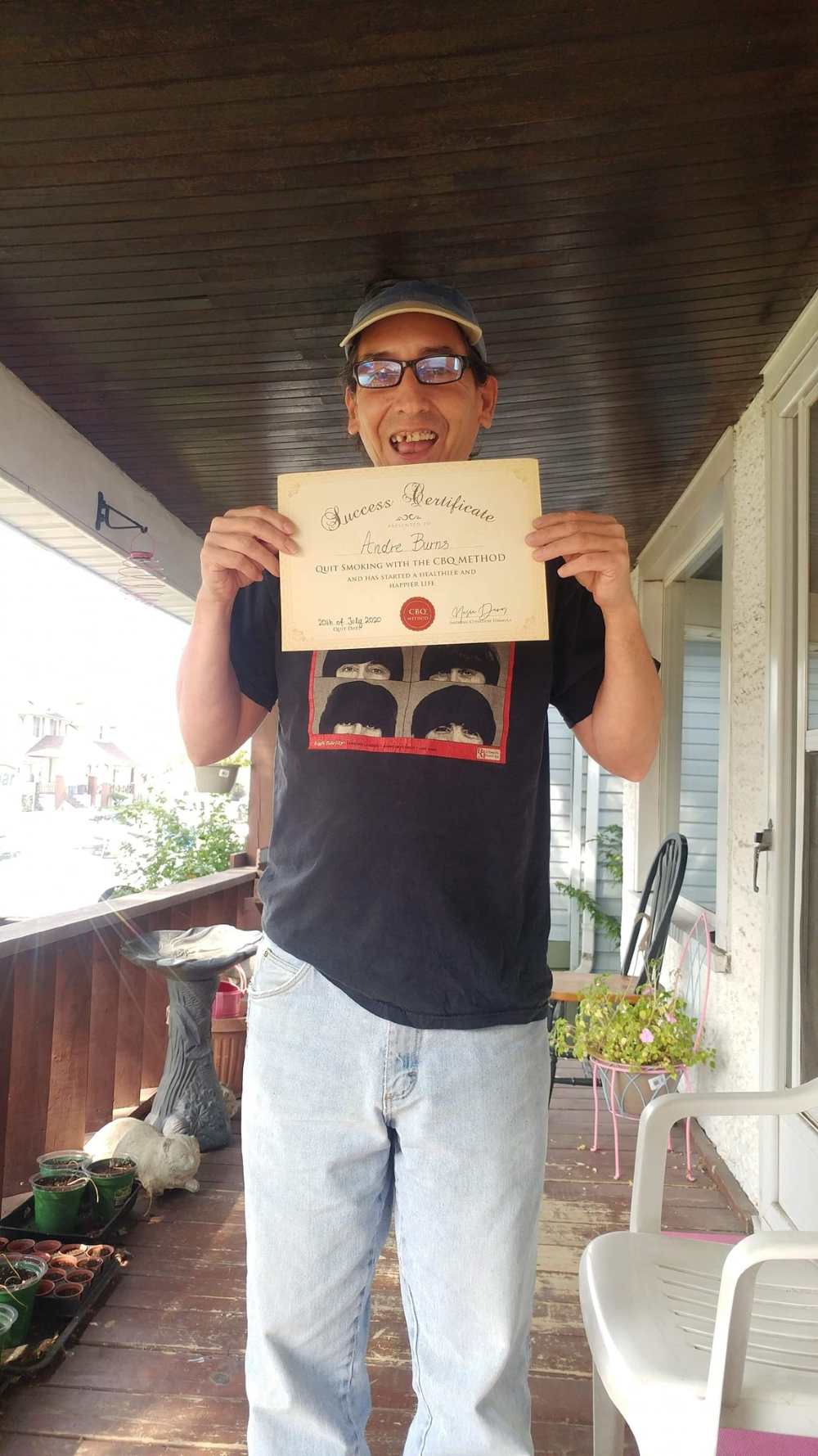 Andre Burns holding his CBQ Success Certificate