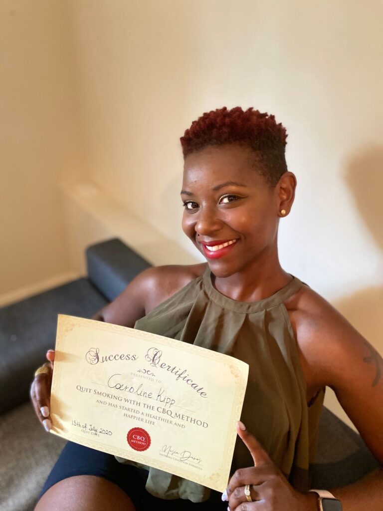 Caroline Kipp holding her CBQ Success Certificate