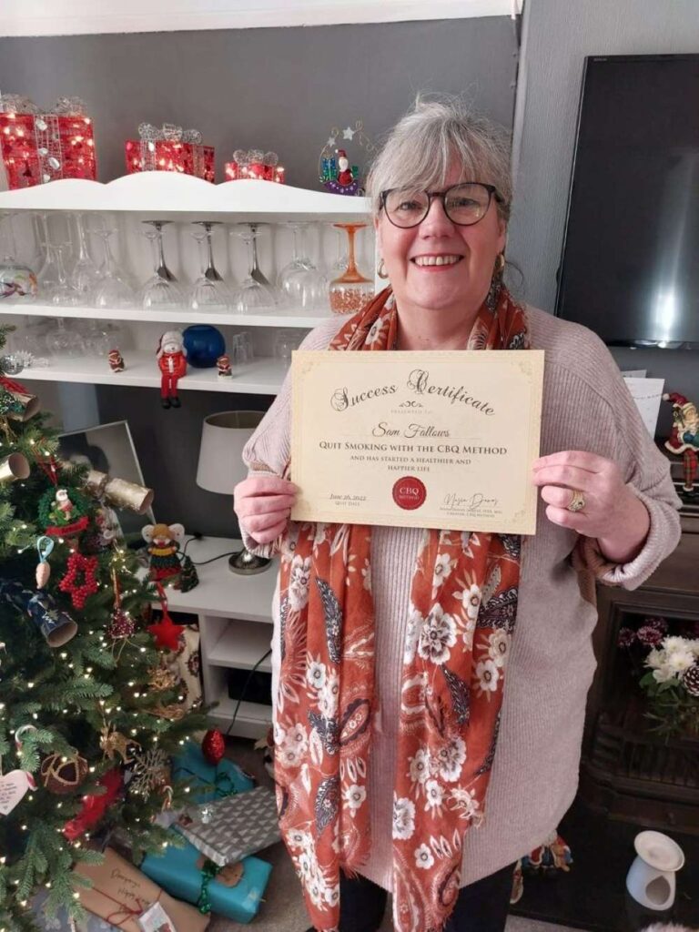 Sam Fallows holding her CBQ Success Certificate