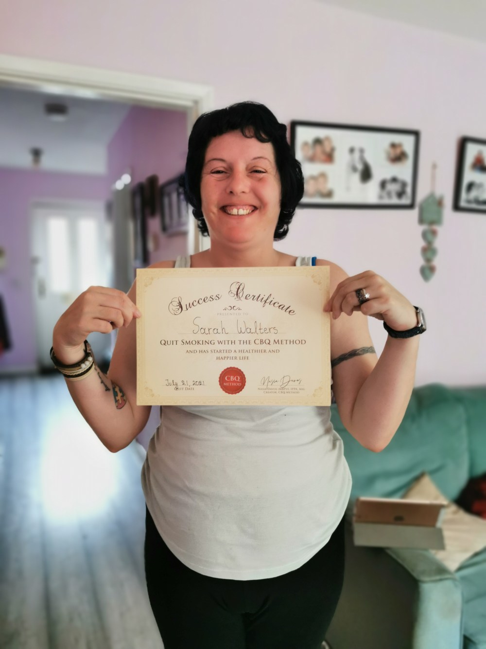 Sarah Walters holding her CBQ Success Certificate