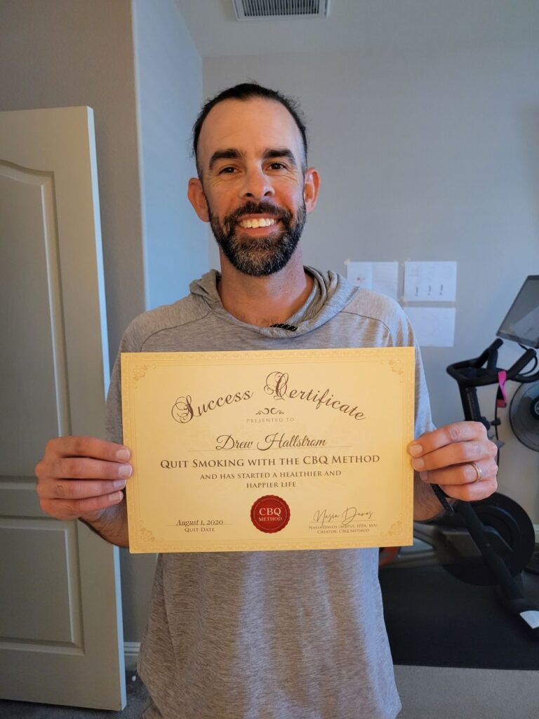 Drew Hallstrom holding his CBQ Success Certificate