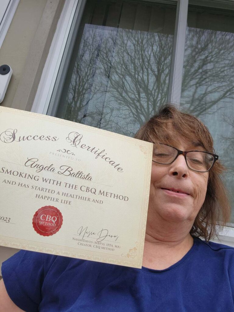 Angela Battista holding her CBQ Success Certificate
