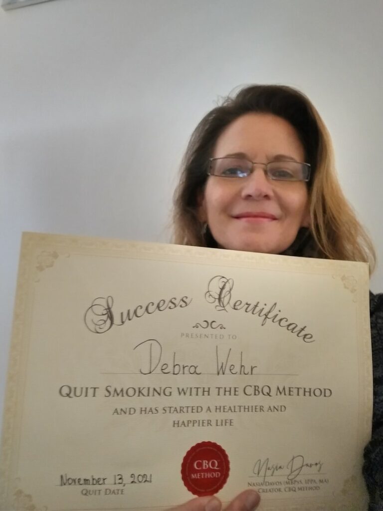 Debra Wehr holding her CBQ Success Certificate