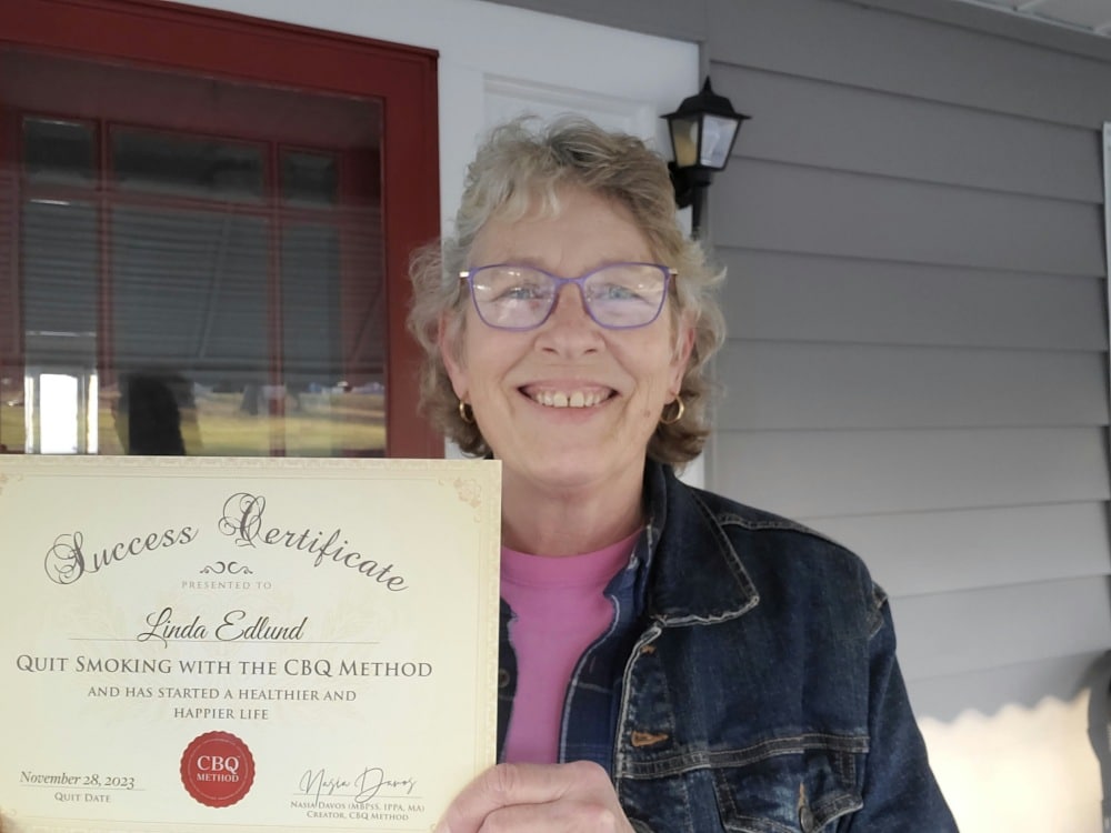 Linda Edlund holding her CBQ Success Certificate