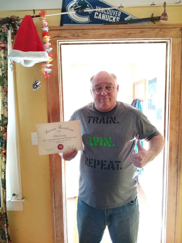 Neil Elavsky holding his CBQ Success Certificate