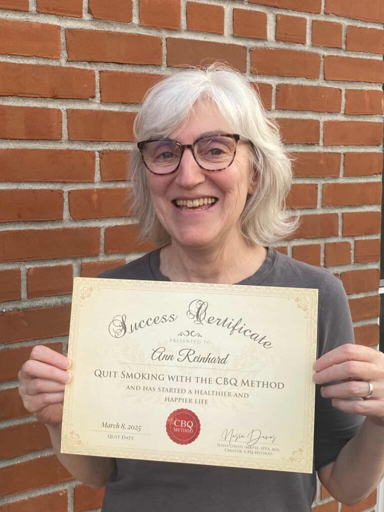 Ann Reinhard Quit Smoking Program member holding her CBQ Success Certificate