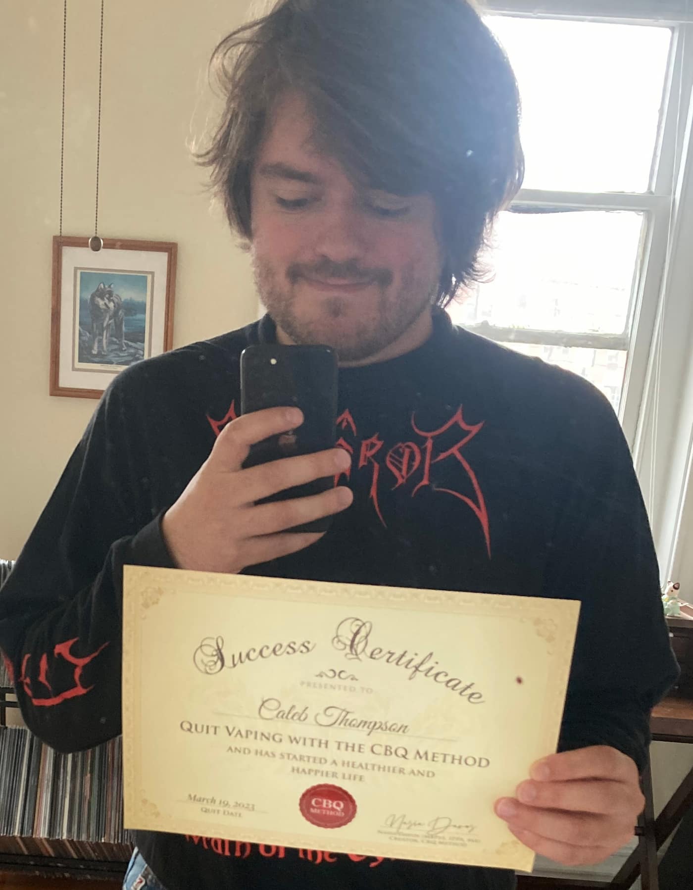 Caleb Thompson holding his CBQ Success Certificate