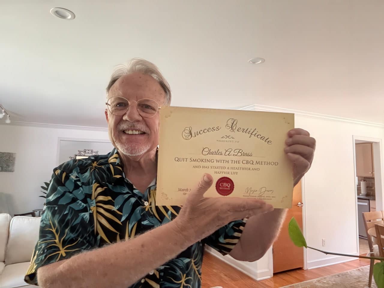 CBQ Nicotine Freedom Program member Charles Brass Holding His CBQ Success Certificate