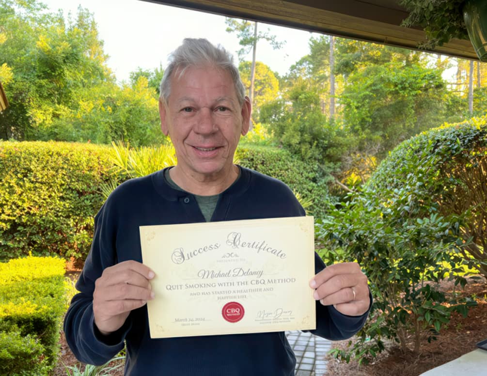CBQ Member Michael Delaney Holding His CBQ Success Certificate