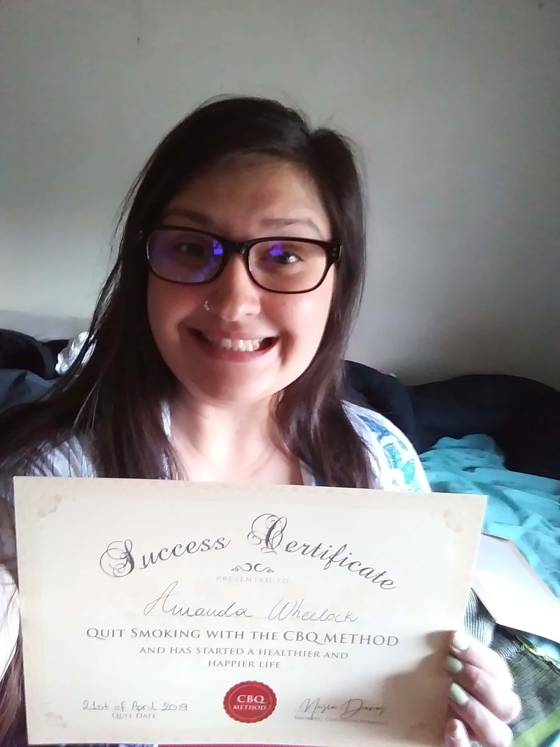 CBQ Nicotine Freedom Program member Amanda Wheelock holding her CBQ Success Certificate