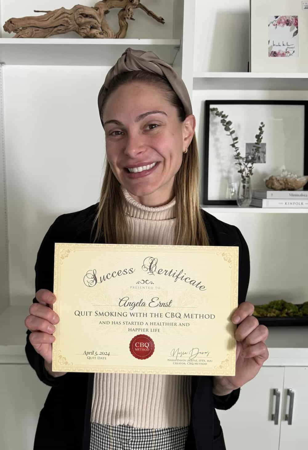 CBQ Quit Smoking Program Angela Ernst Holding Her CBQ Success Certificate