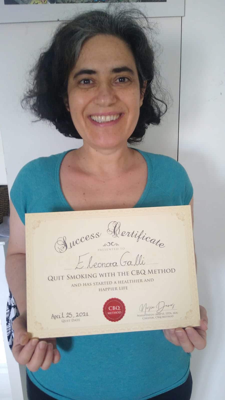 CBQ Nicotine Freedom Program member Eleonora Galli holding her CBQ Success Certificate