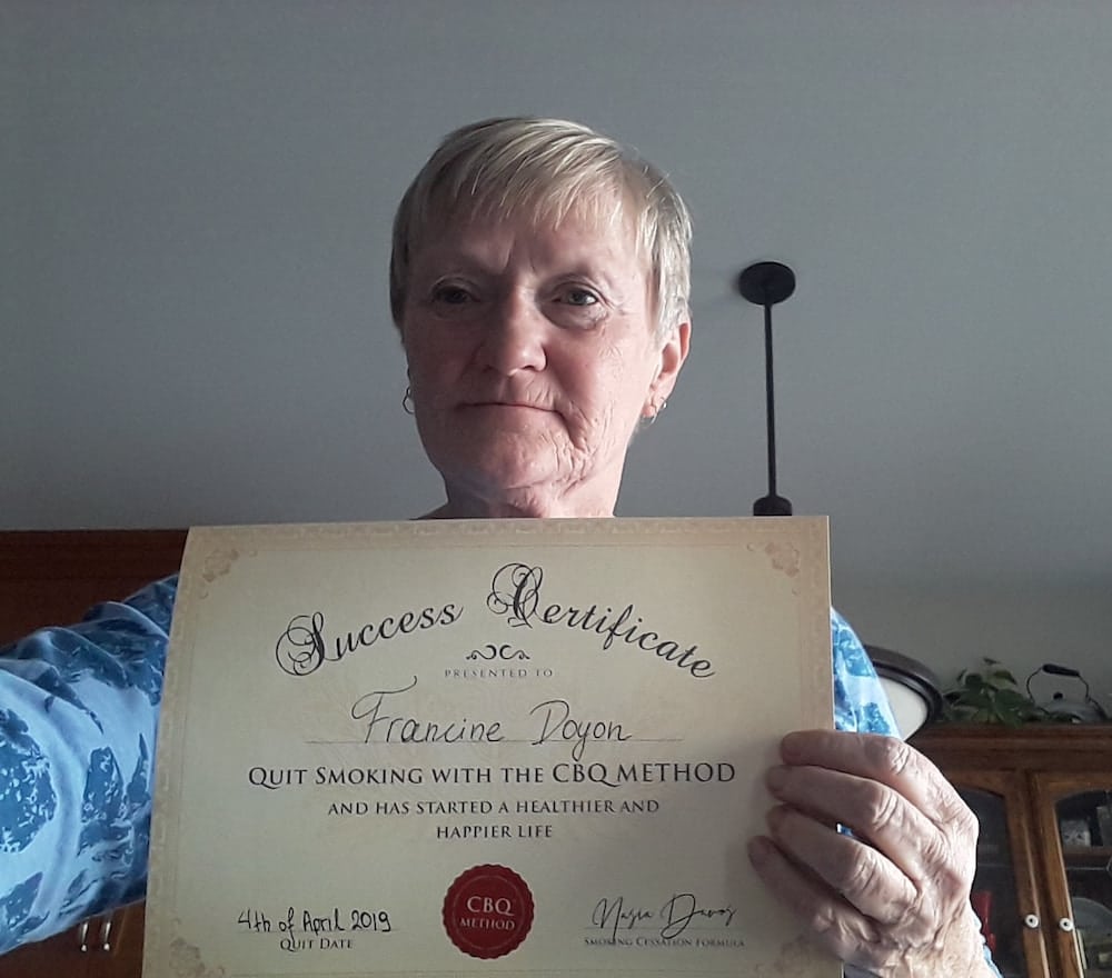 CBQ Quit Smoking Program Francine Doyon Holding Her CBQ Success Certificate