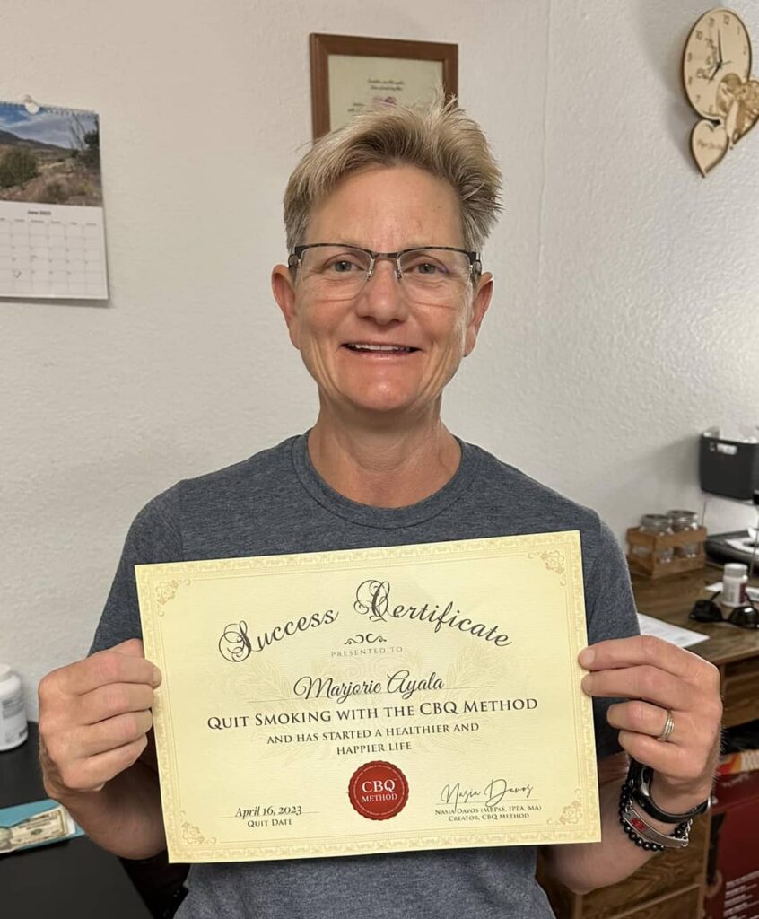 CBQ Nicotine Freedom Program member Marjorie Ayala holding her CBQ Success Certificate