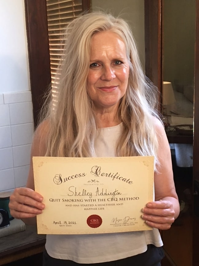 CBQ Nicotine Freedom Program member Shelley Addington holding her CBQ Success Certificate