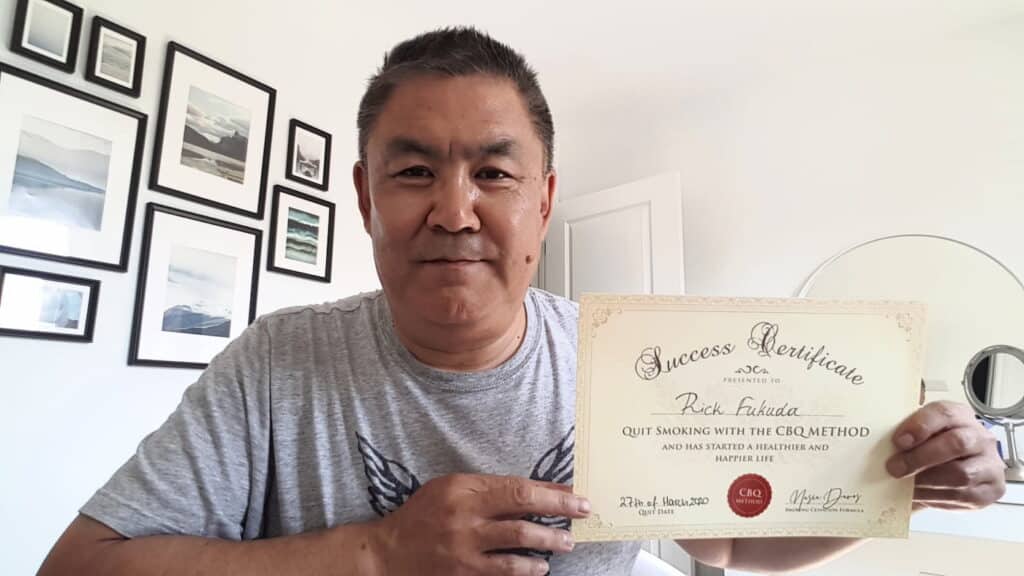 CBQ Nicotine Freedom Member Rick Fukuda Holding His CBQ Success Certificate