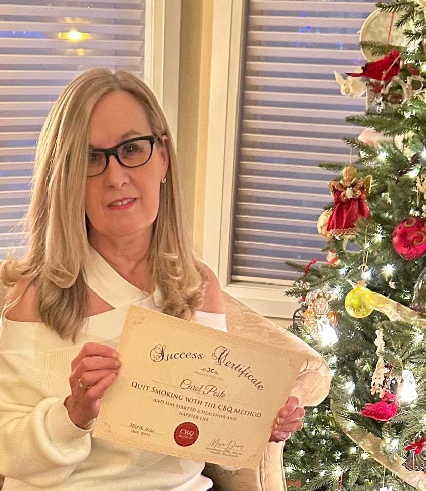CBQ Nicotine Freedom Program member Carol Poste holding her CBQ Success Certificate