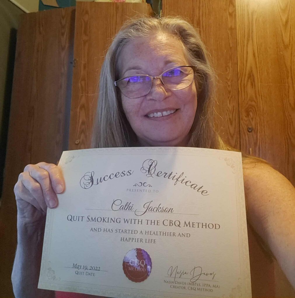 CBQ Nicotine Freedom Program member Cathi Jackson holding her CBQ Success Certificate