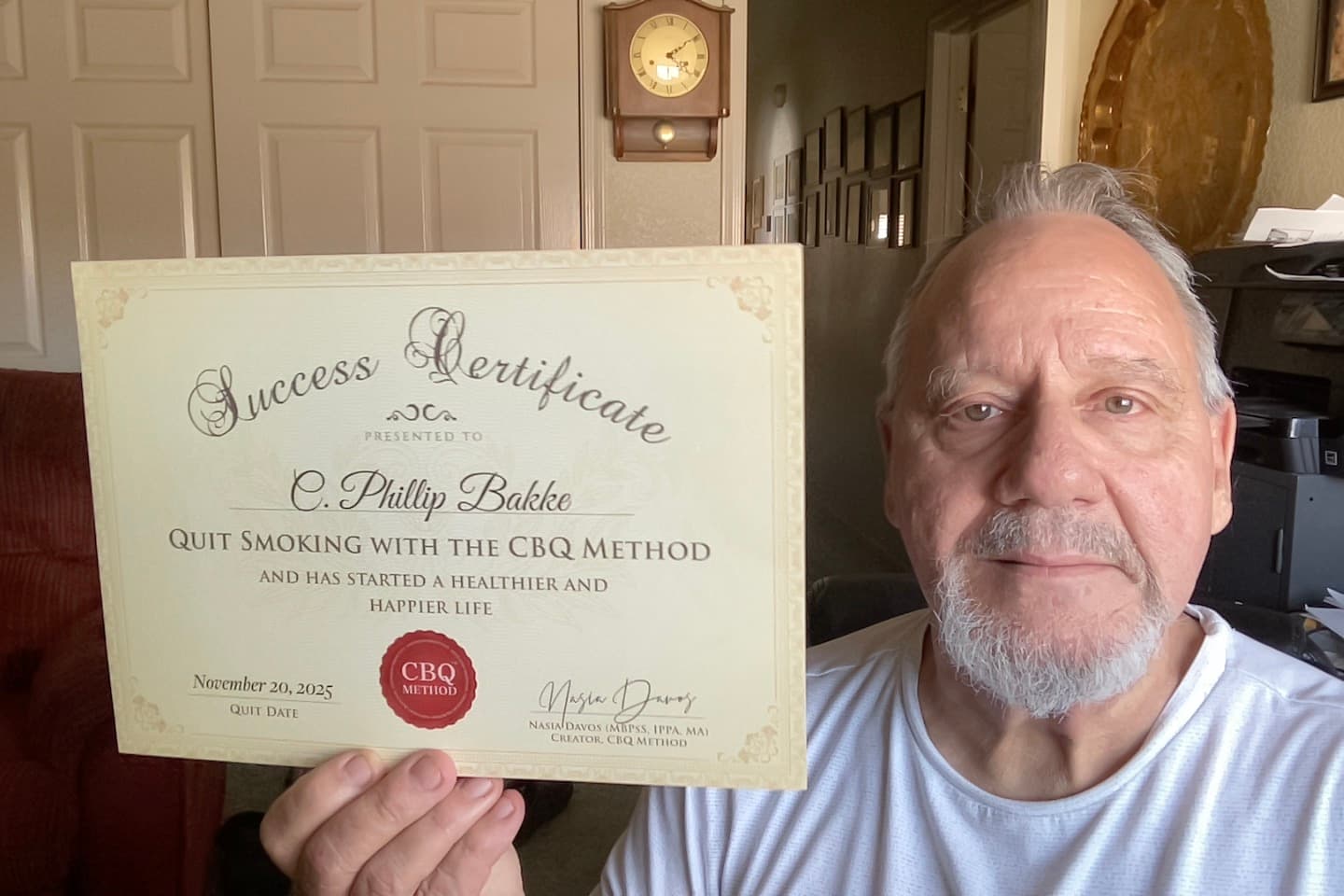 CBQ Program member Christian Phillip Bakke holding his CBQ Success Certificate