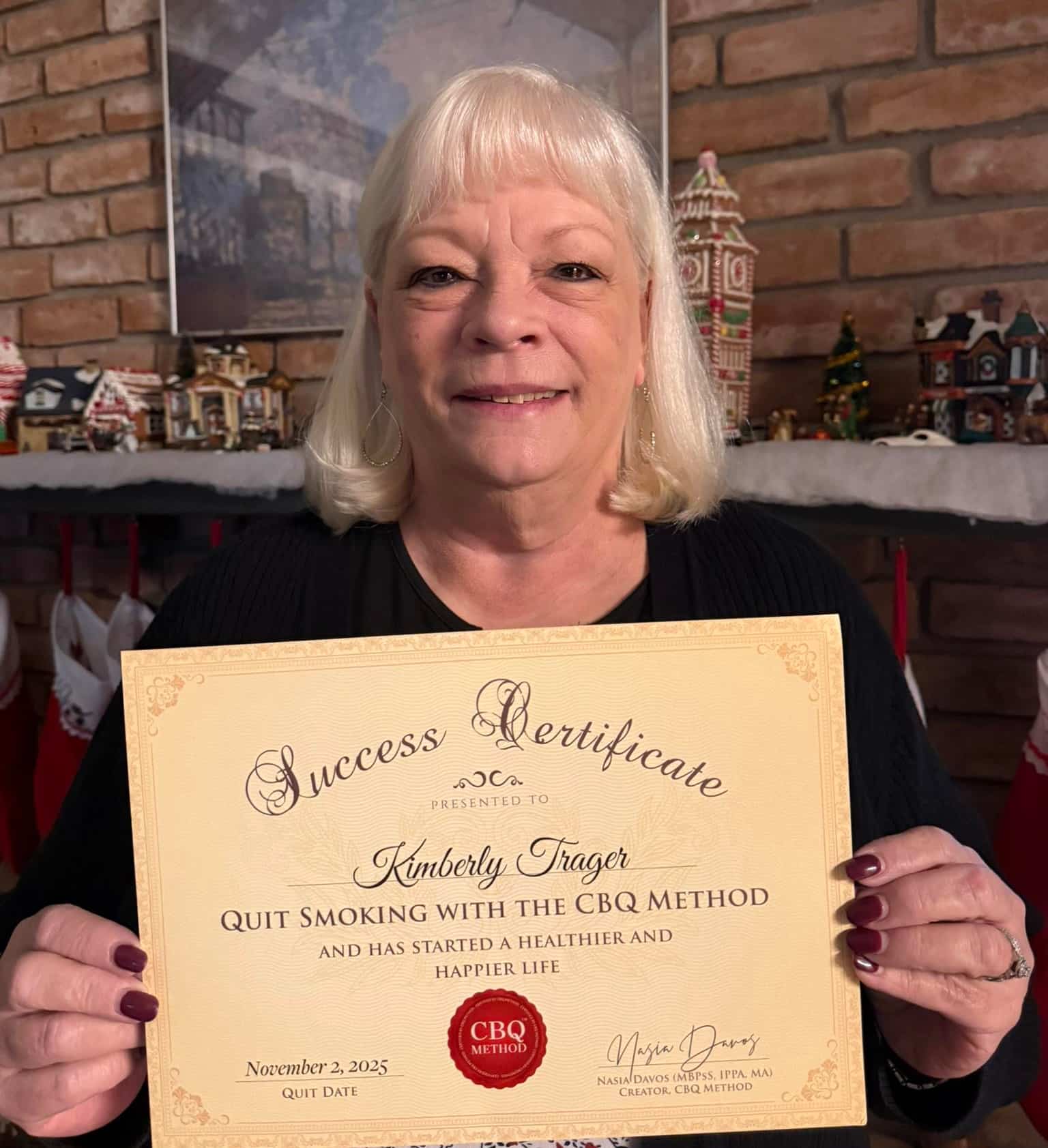 CBQ Nicotine Freedom Program member Kimberly Trager holding her CBQ Success Certificate