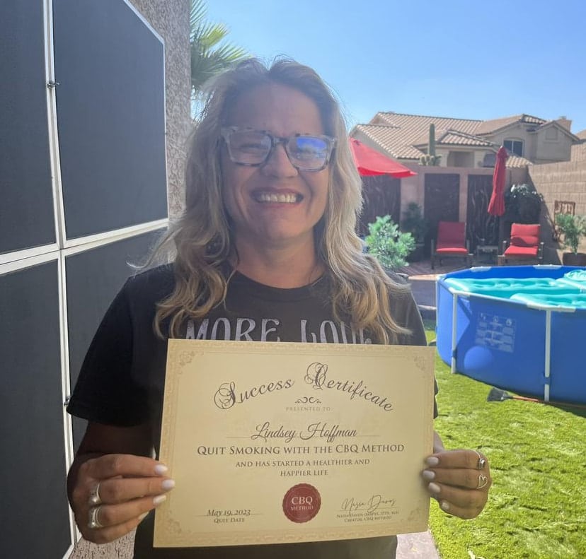 CBQ Nicotine Freedom Program member Lindsey Hoffman holding her CBQ Success Certificate
