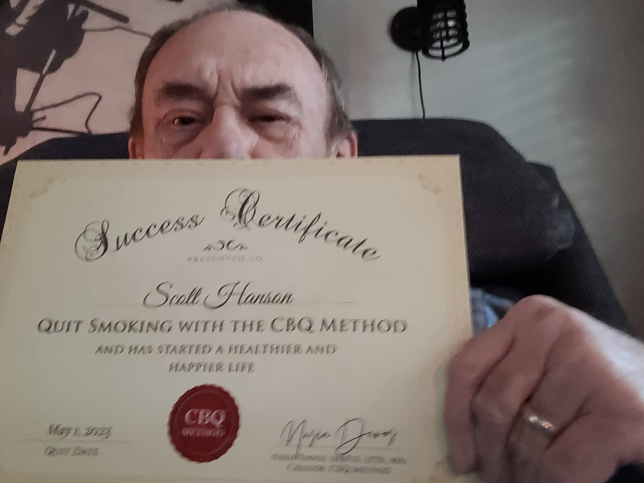 CBQ Nicotine Freedom Program member Scott Hanson holding his CBQ Success Certificate