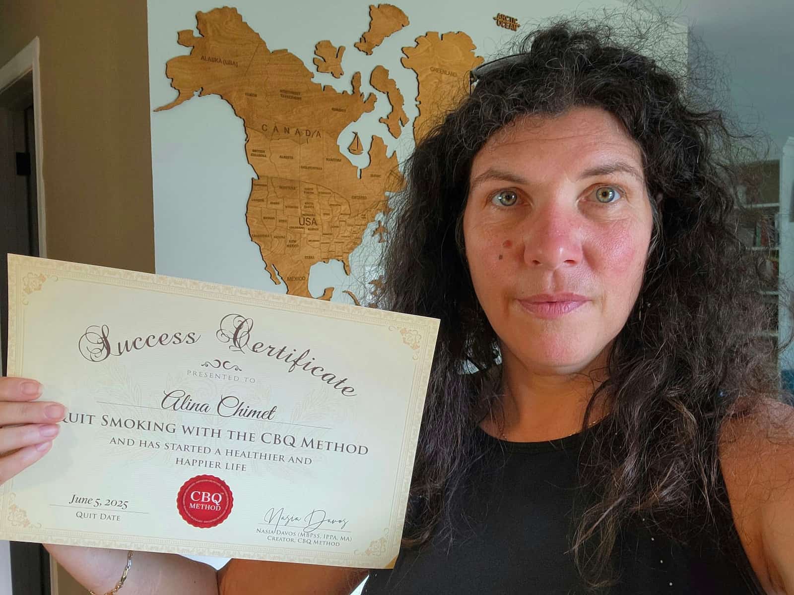 CBQ Nicotine Freedom Program member Alina Chimet holding her CBQ Success Certificate