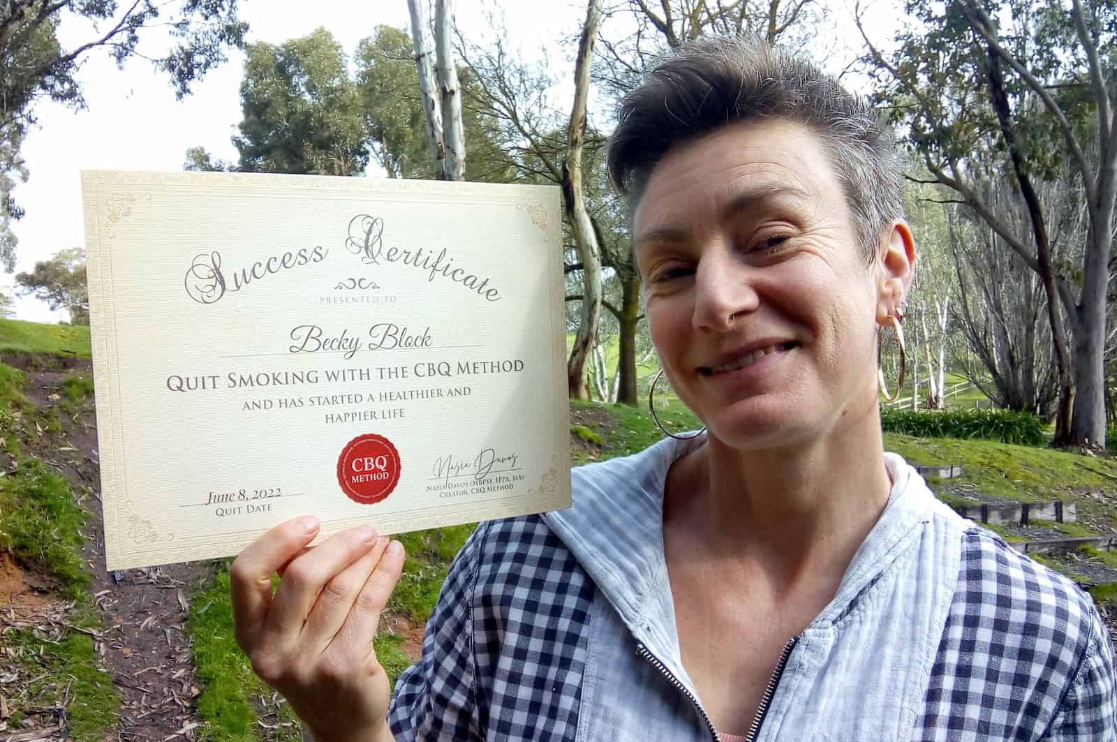 CBQ Nicotine Freedom Program member Becky Block holding her CBQ Success Certificate