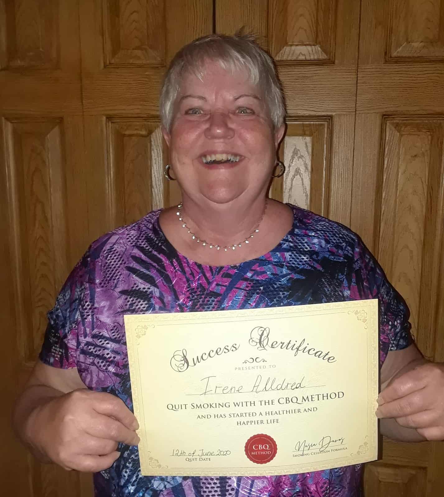 CBQ Nicotine Freedom Program Irene Alldred holding her CBQ Success Certificate