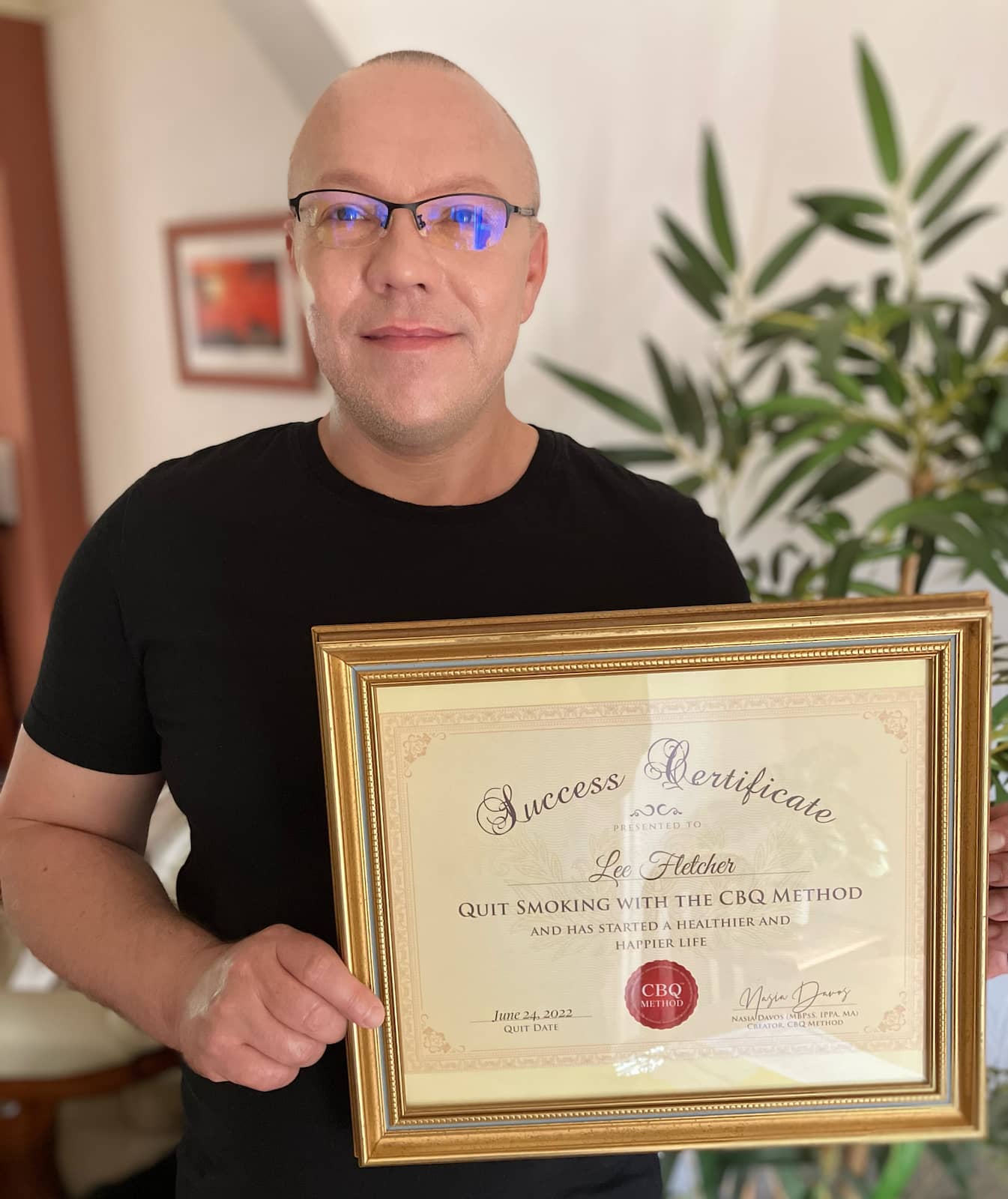 CBQ Nicotine Freedom Program member Lee Fletcher holding his CBQ Success Certificate