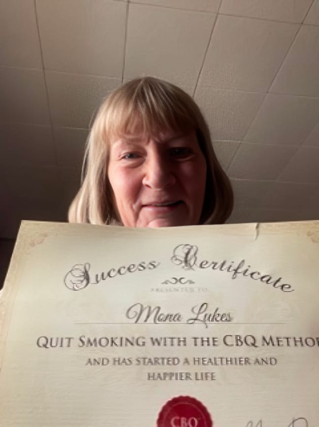 CBQ Nicotine Freedom Program Mona Lukes holding her CBQ Success Certificate