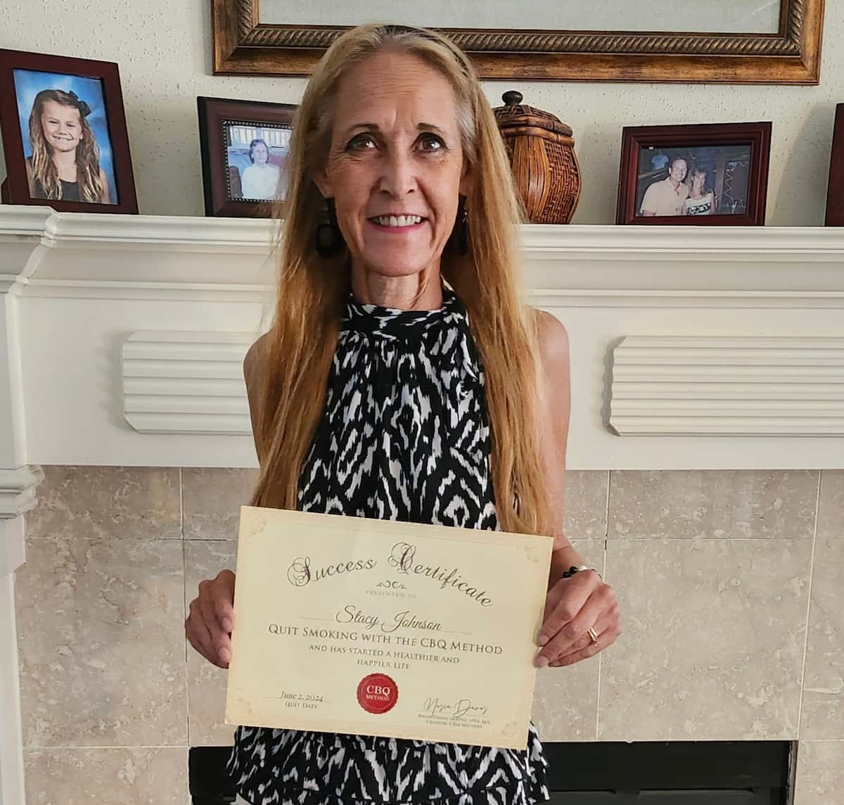 CBQ Nicotine Freedom Program member Stacy Johnson holding her CBQ Success Certificate