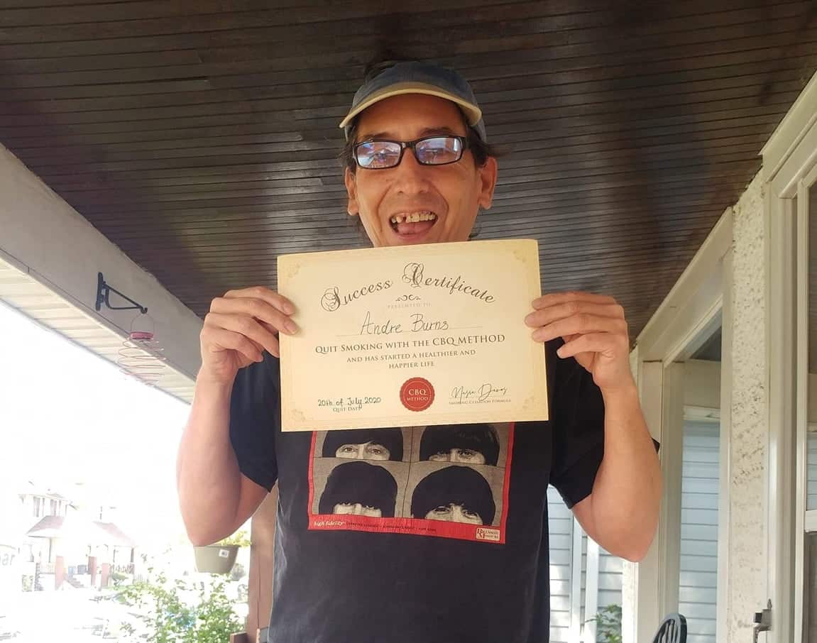 CBQ Nicotine Freedom Program member Andre Burns holding his CBQ Success Certificate